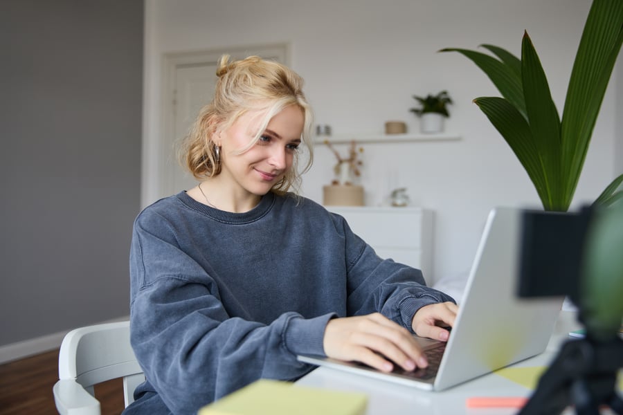 portrait-young-blond-woman-female-college-student-works-from-home-assignment-uses-laptop portrait-young-blond-woman-female-college-student-works-from-home-assignment-uses-laptop